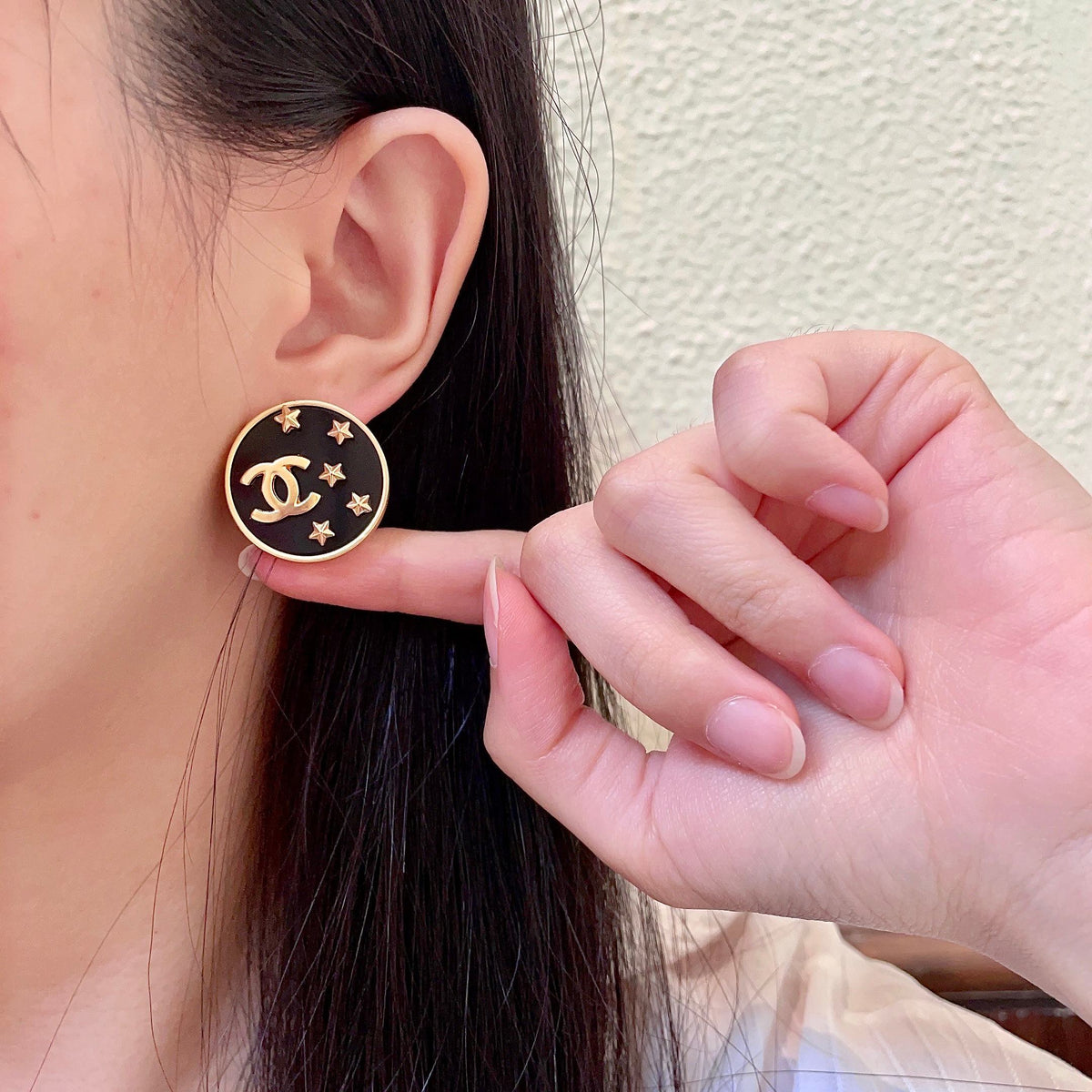 Martin Graham stud earrings in polished metal-tone – front product view