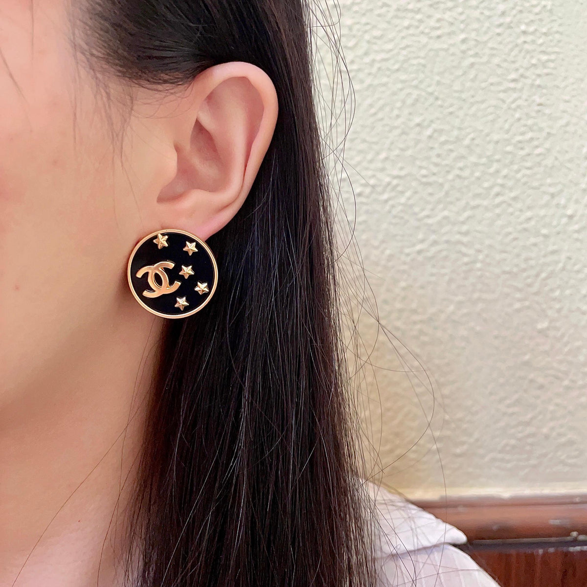 Martin Graham stud earrings in polished metal-tone – detail view
