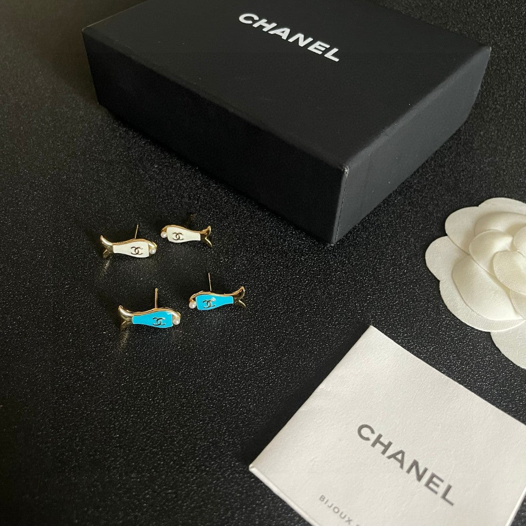 Martin Graham stud earrings in polished metal-tone – close-up detail