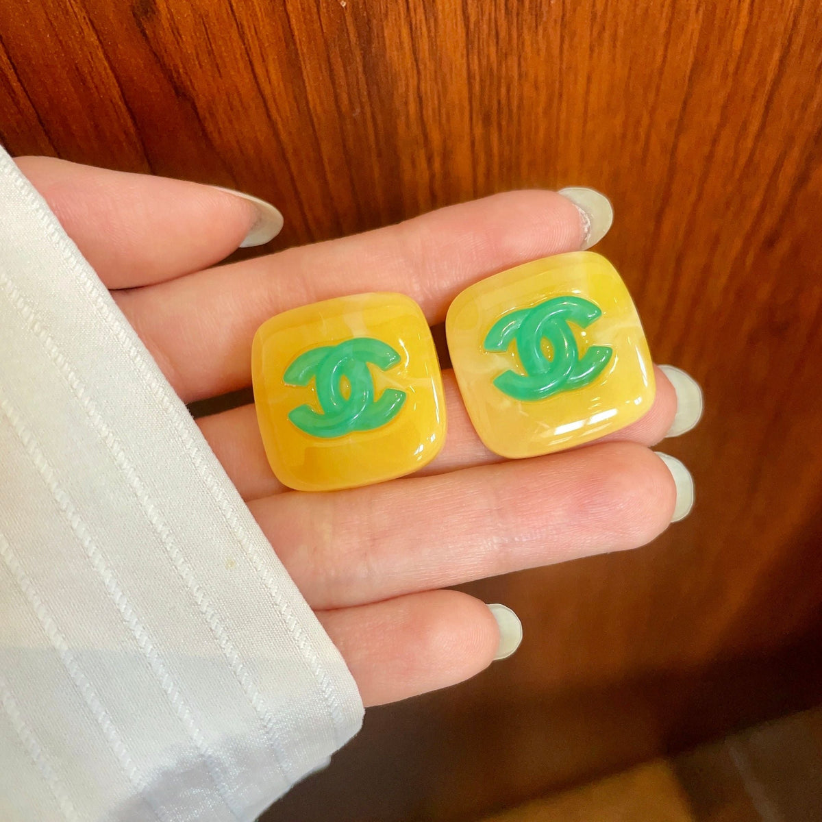 Martin Graham stud earrings in polished metal-tone – side detail