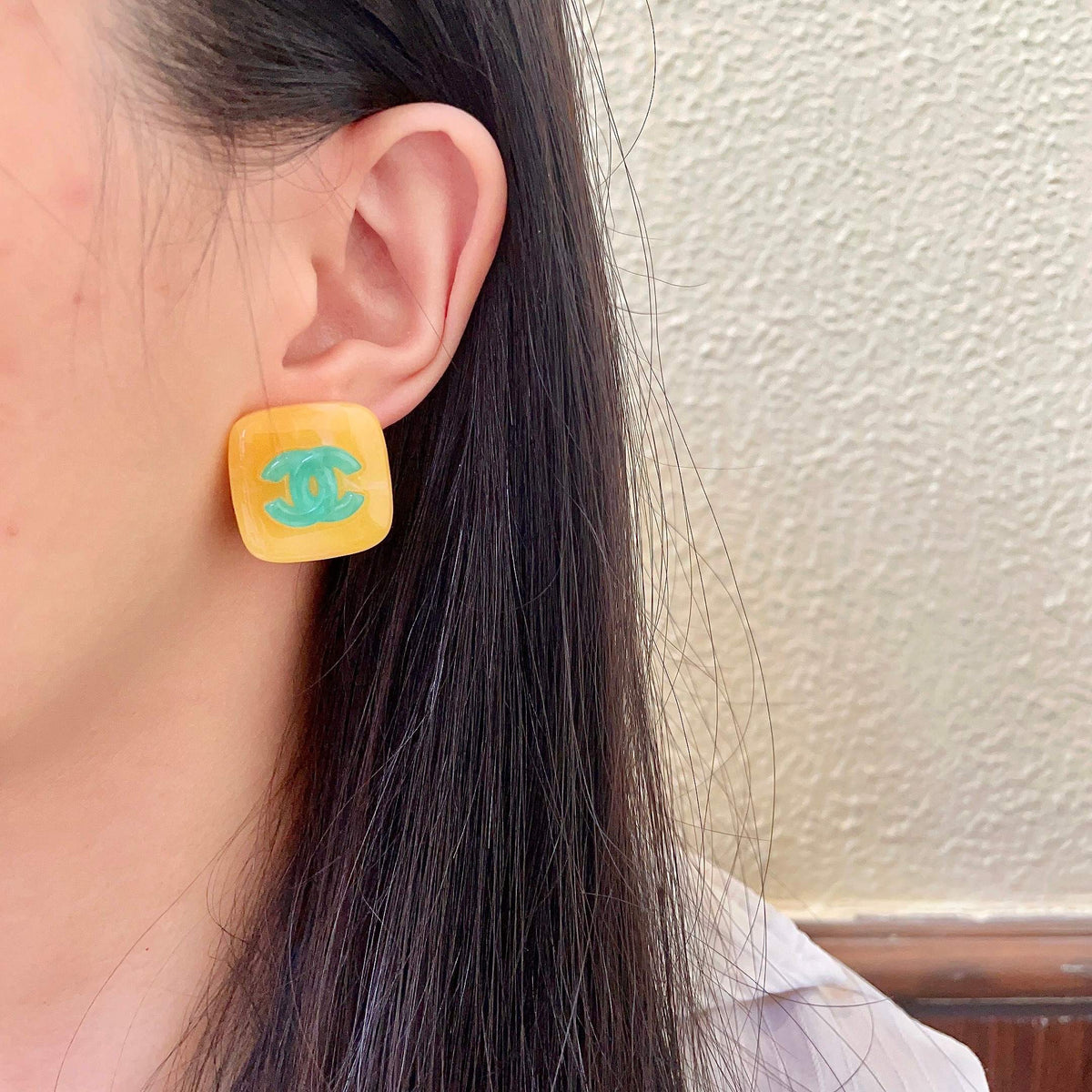 Martin Graham stud earrings in polished metal-tone – detail view