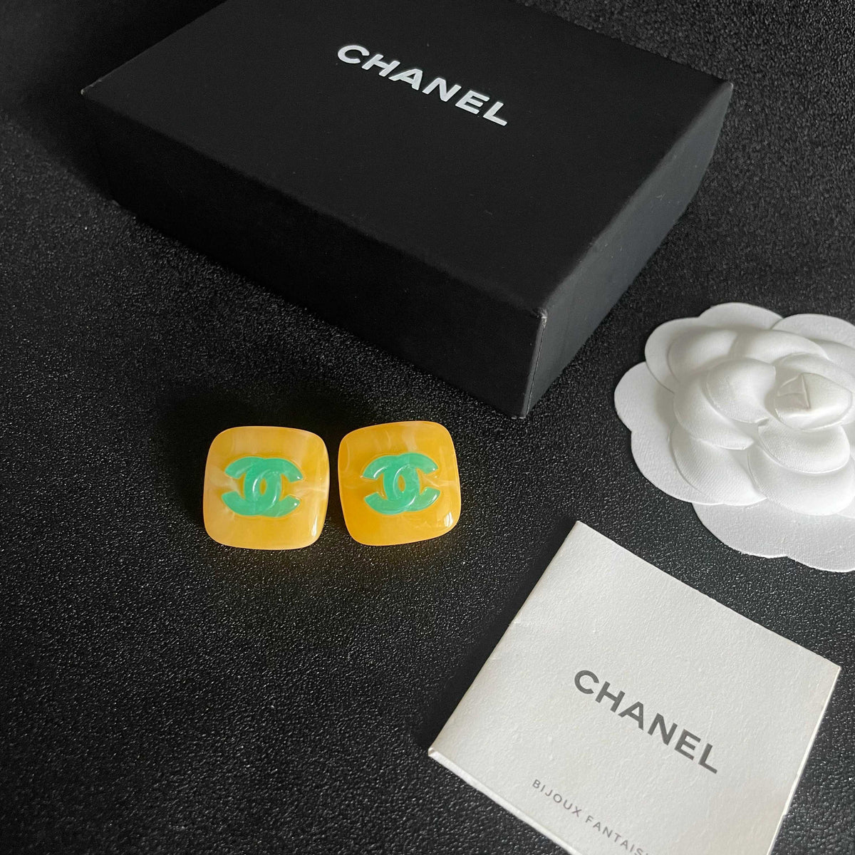 Martin Graham stud earrings in polished metal-tone – close-up detail