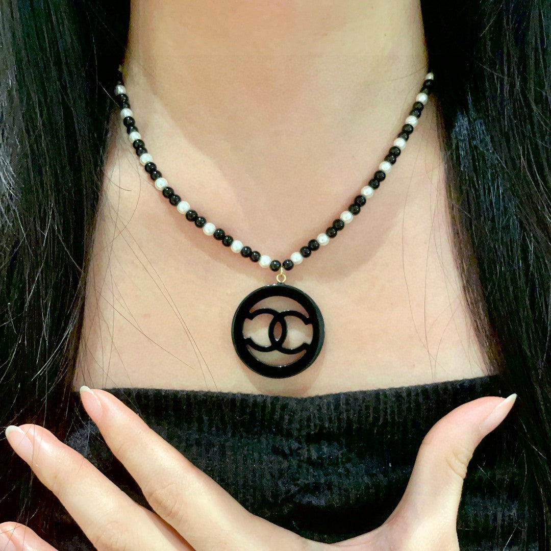Martin Graham pendant necklace in polished metal-tone – front product view