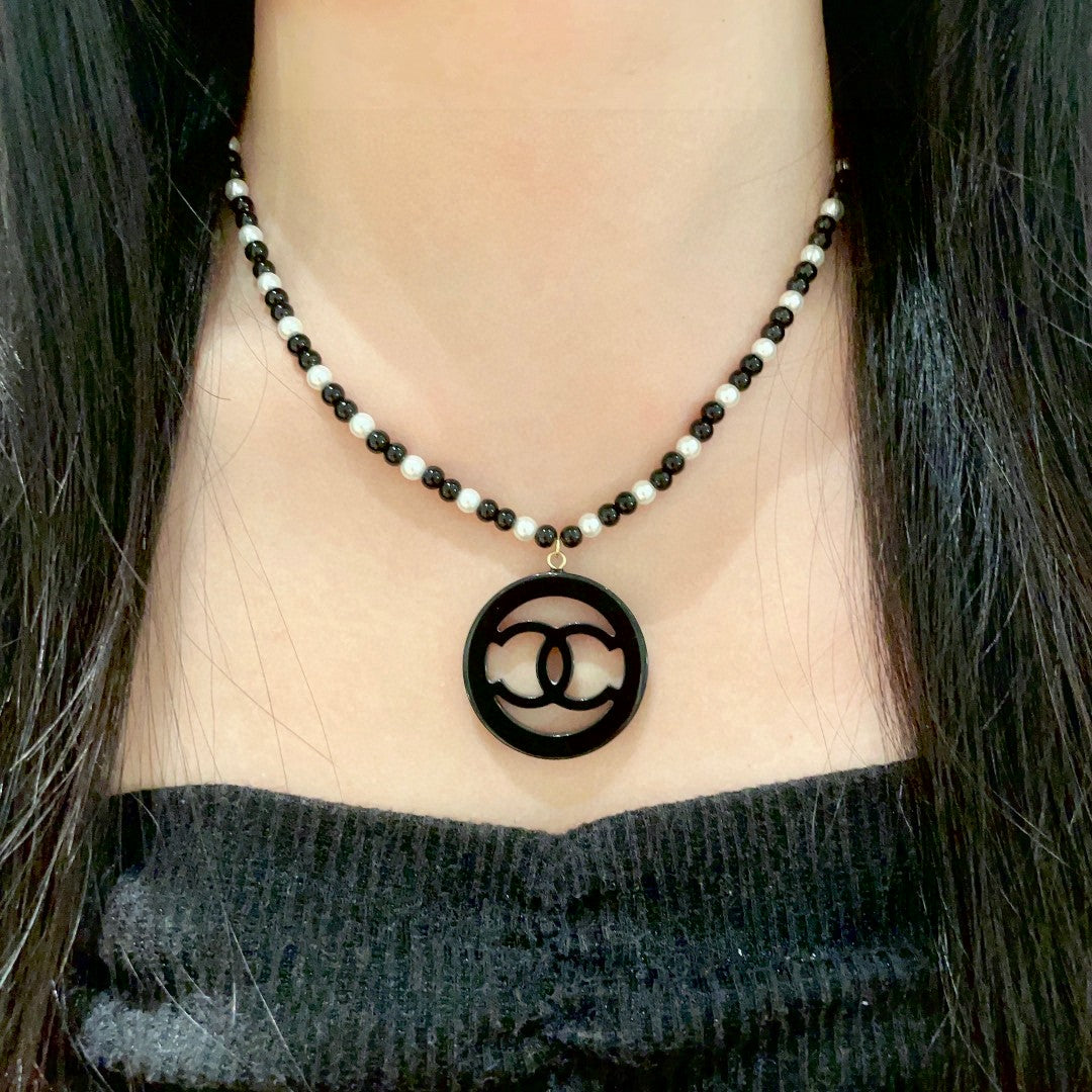 Martin Graham pendant necklace in polished metal-tone – detail view