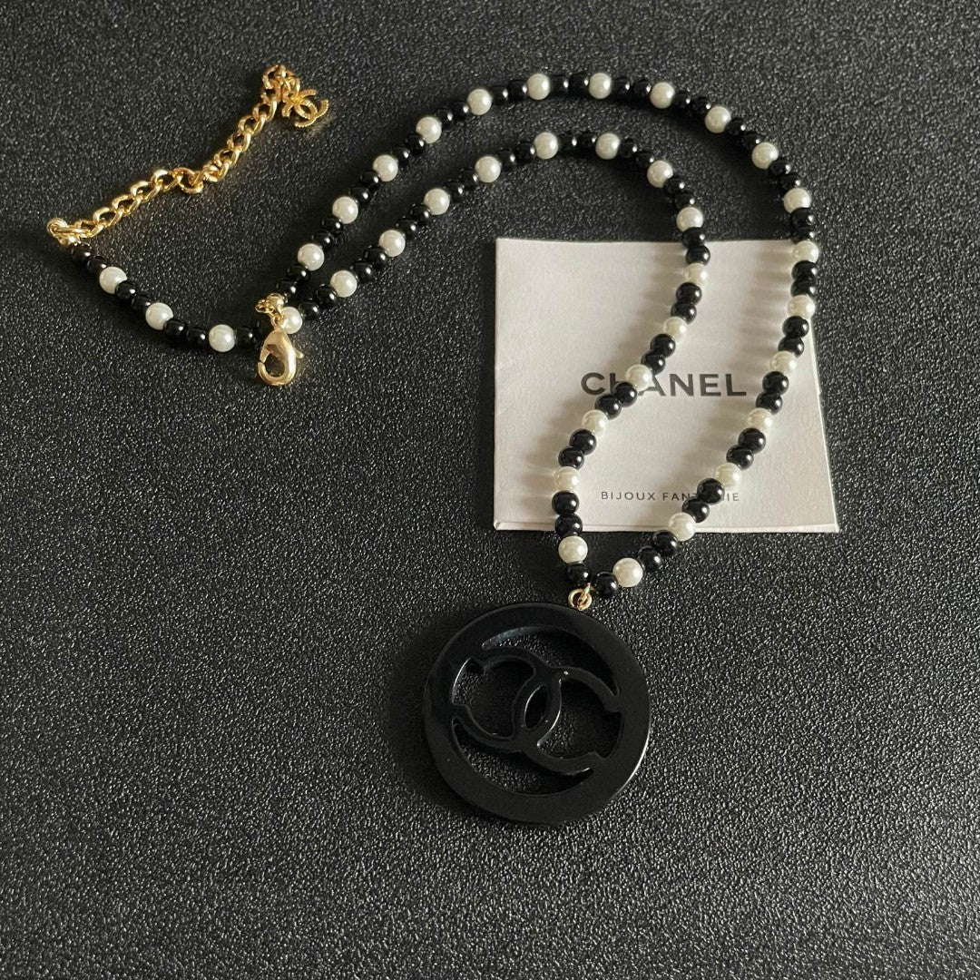 Martin Graham pendant necklace in polished metal-tone – front product view