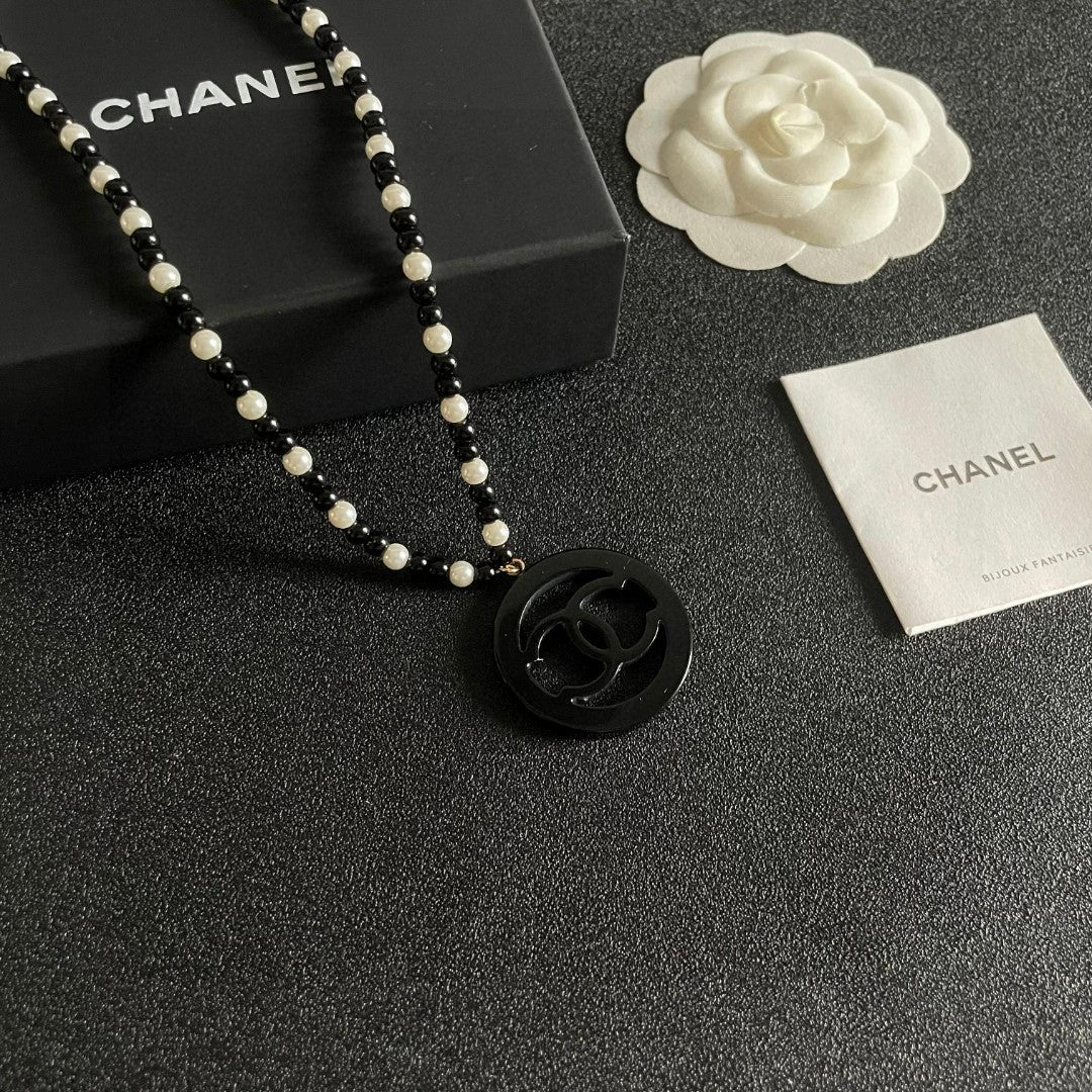 Martin Graham pendant necklace in polished metal-tone – styled product view