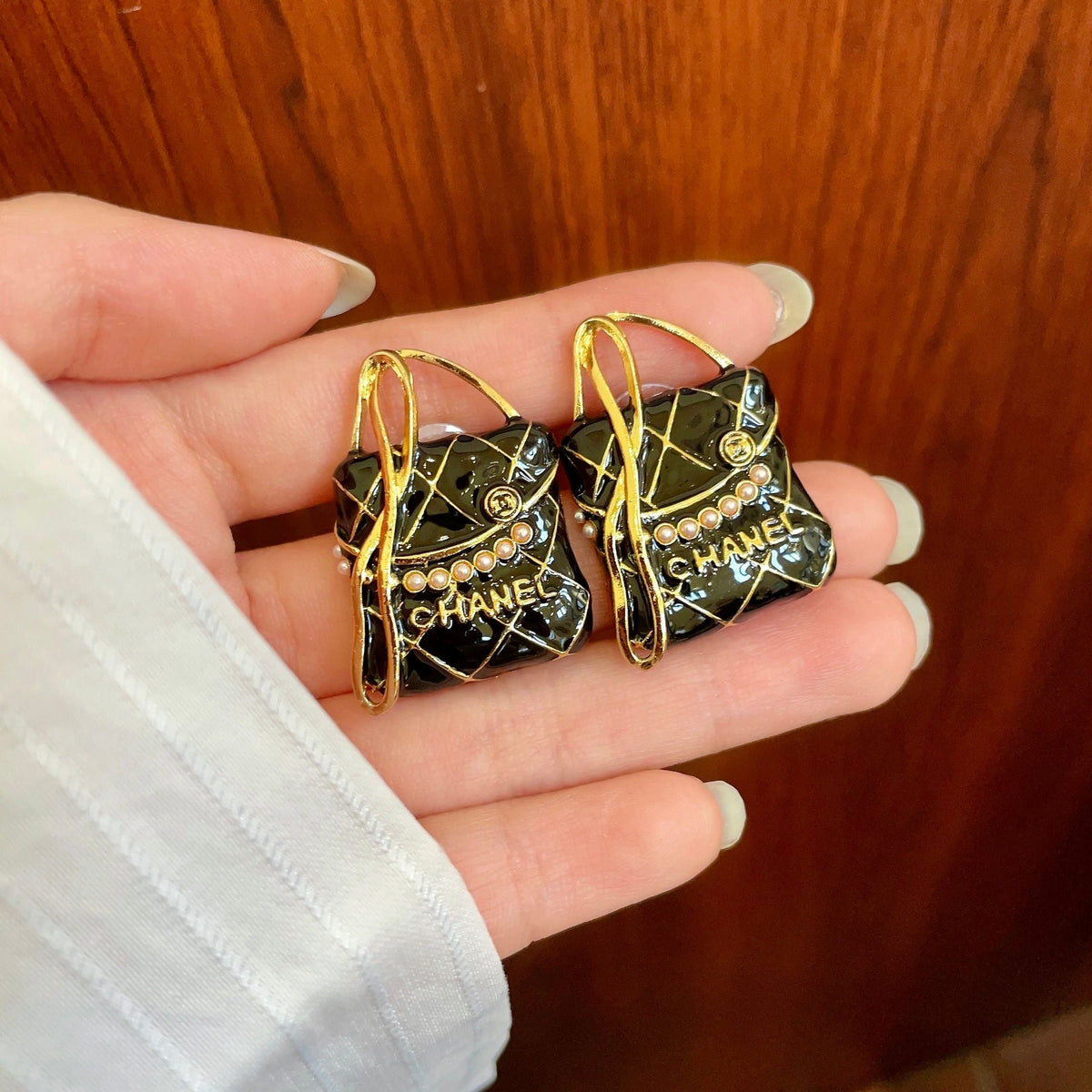 Martin Graham stud earrings in polished metal-tone – side detail