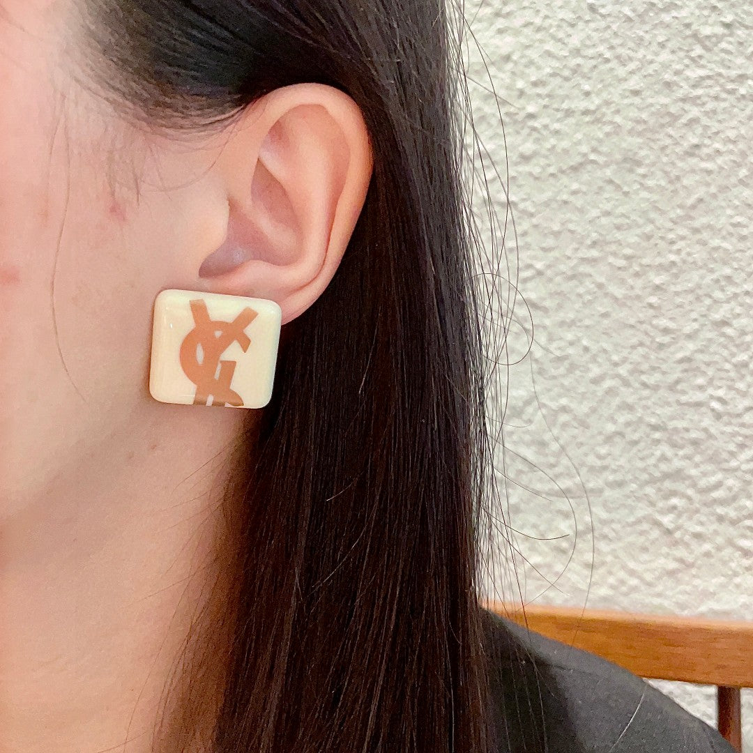 Martin Graham stud earrings in polished metal-tone – detail view