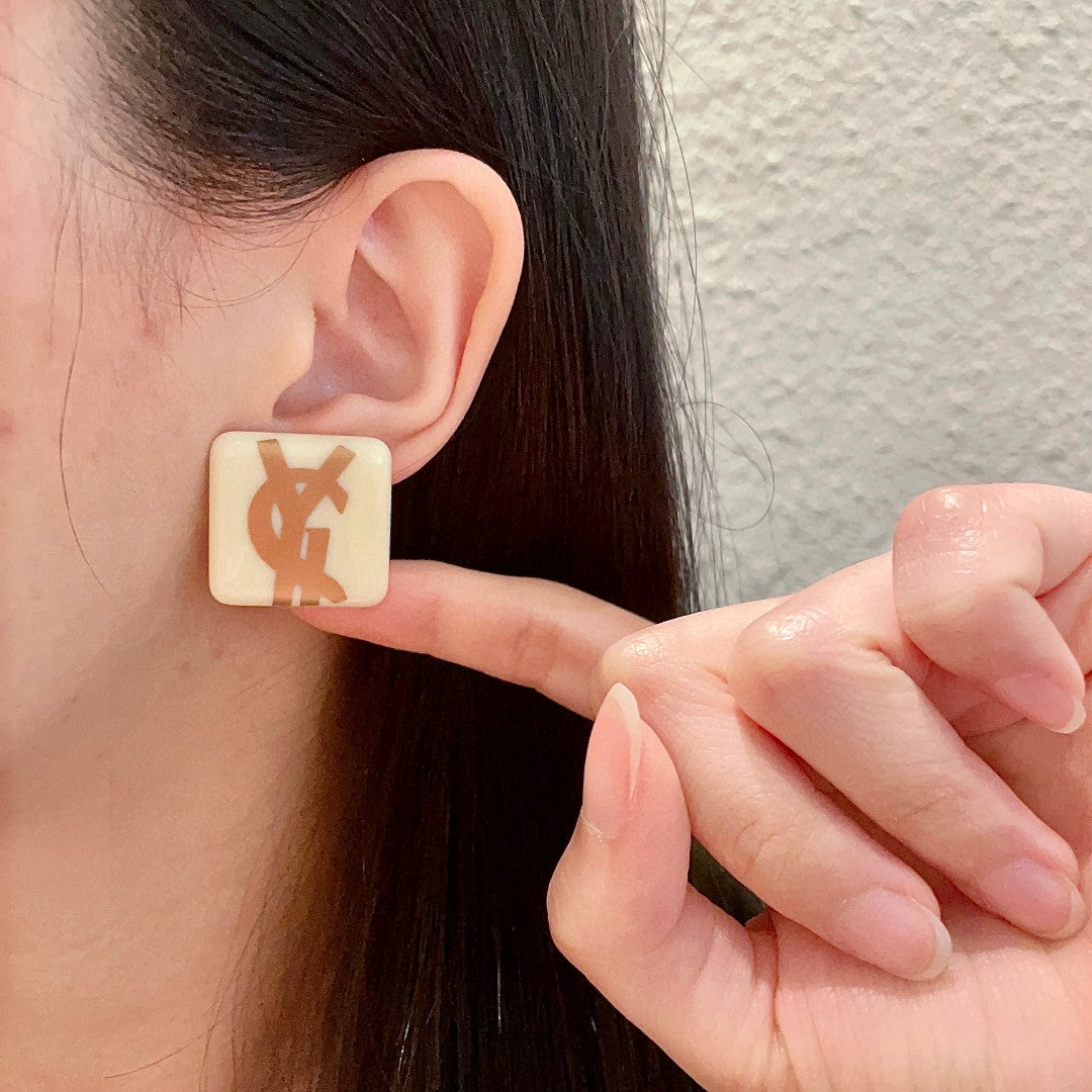 Martin Graham stud earrings in polished metal-tone – front product view