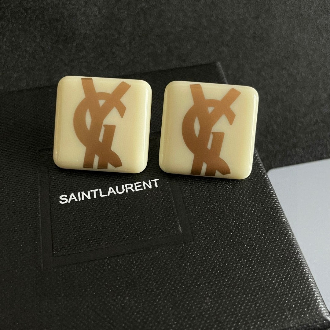 Martin Graham stud earrings in polished metal-tone – detail view