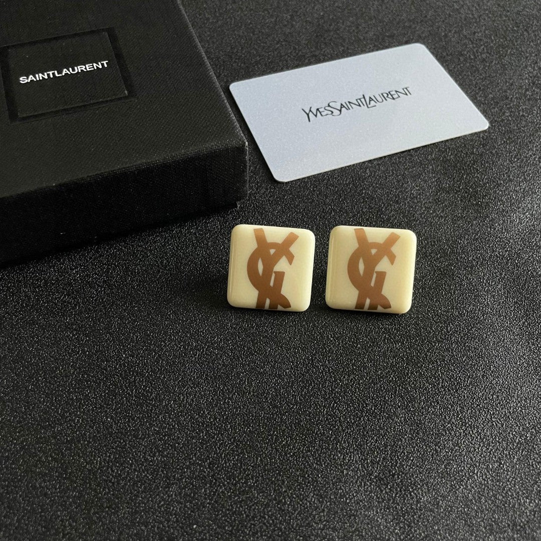 Martin Graham stud earrings in polished metal-tone – styled product view