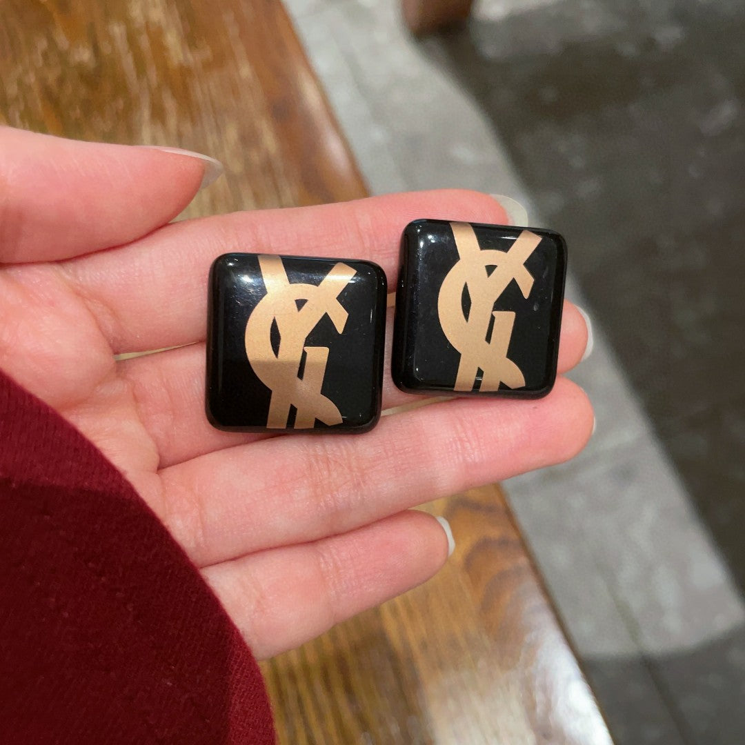 Martin Graham stud earrings in polished metal-tone – side detail