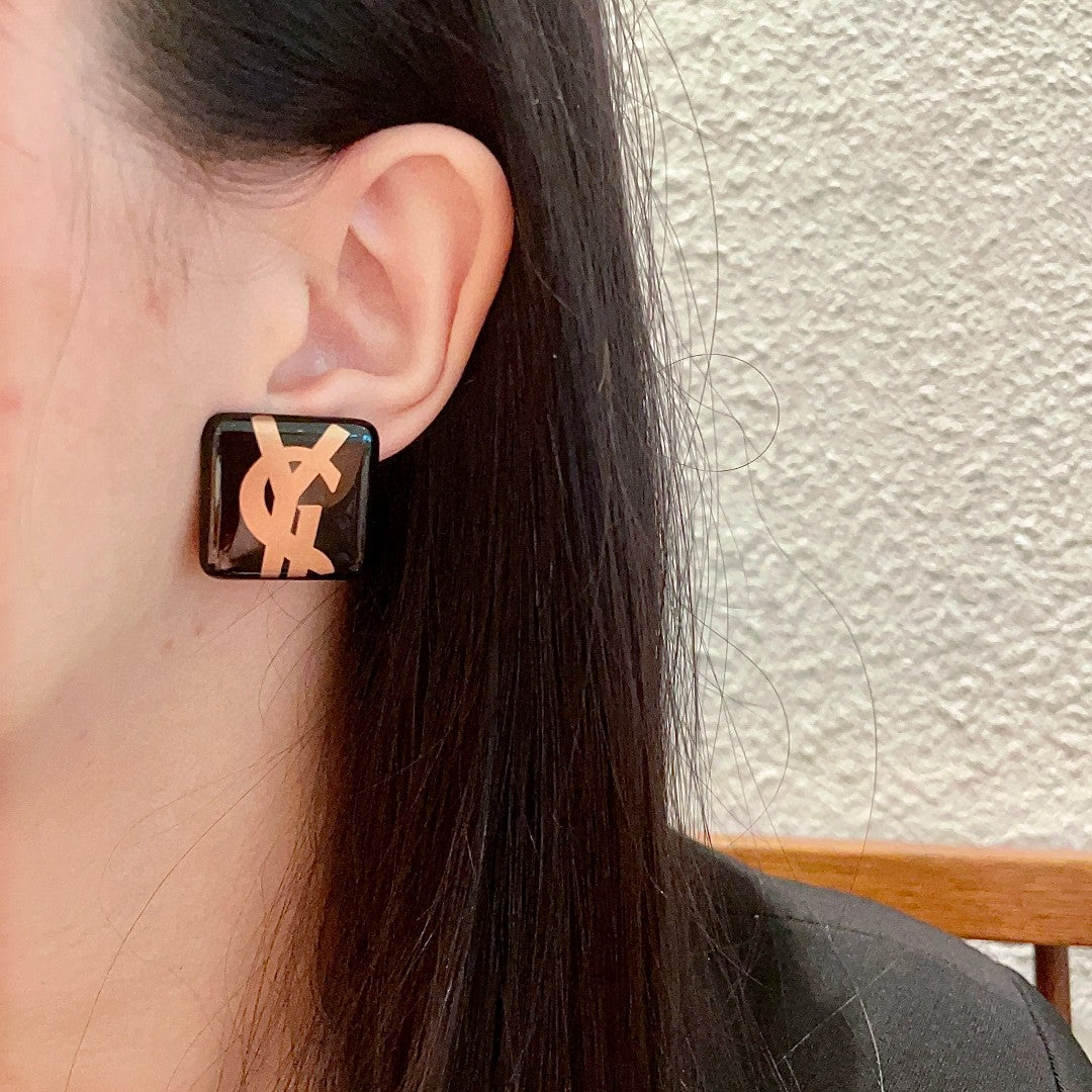 Martin Graham stud earrings in polished metal-tone – detail view