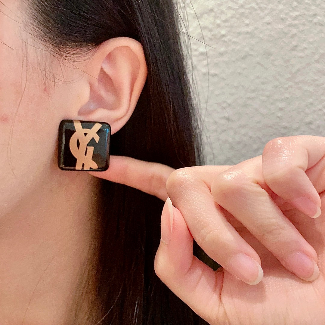 Martin Graham stud earrings in polished metal-tone – front product view