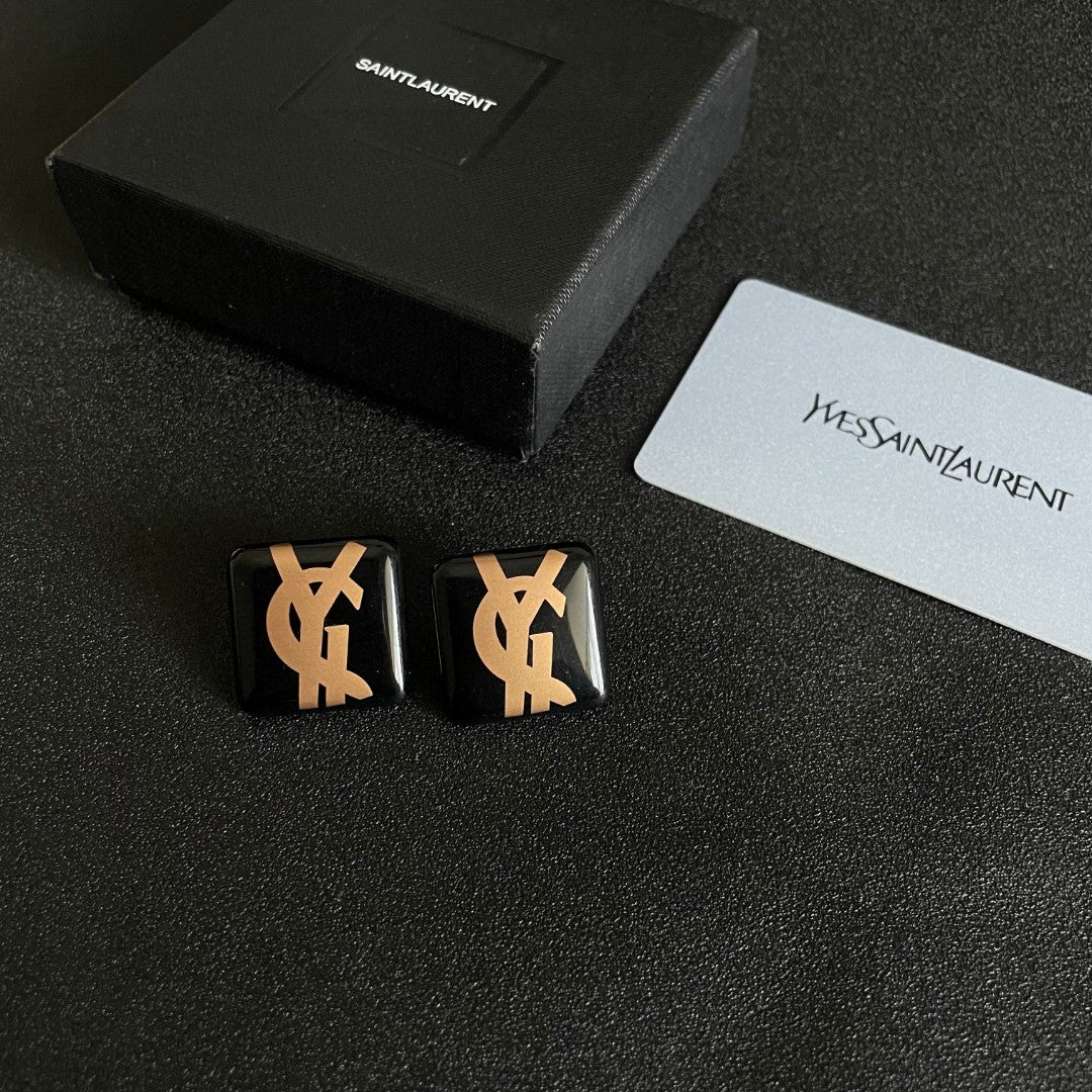 Martin Graham stud earrings in polished metal-tone – close-up detail