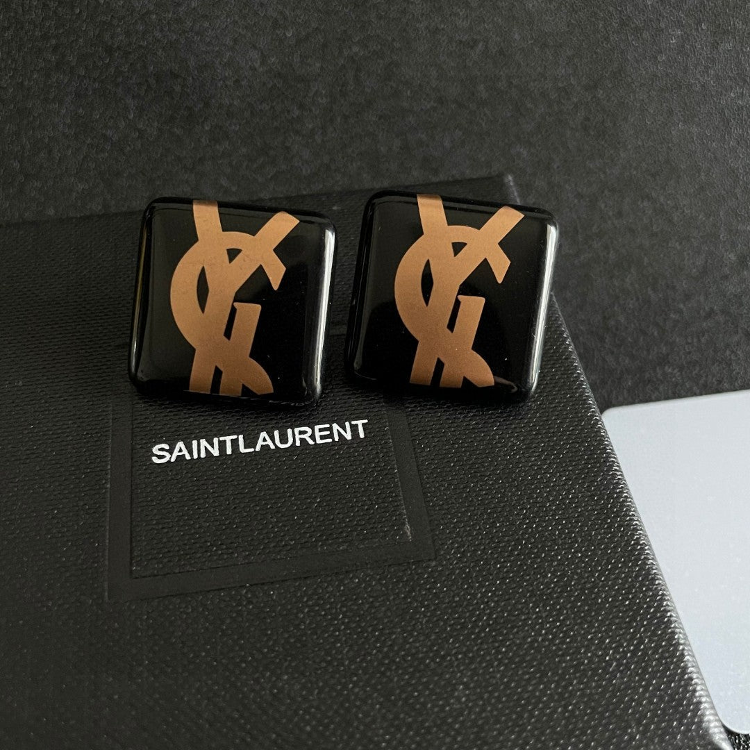 Martin Graham stud earrings in polished metal-tone – detail view
