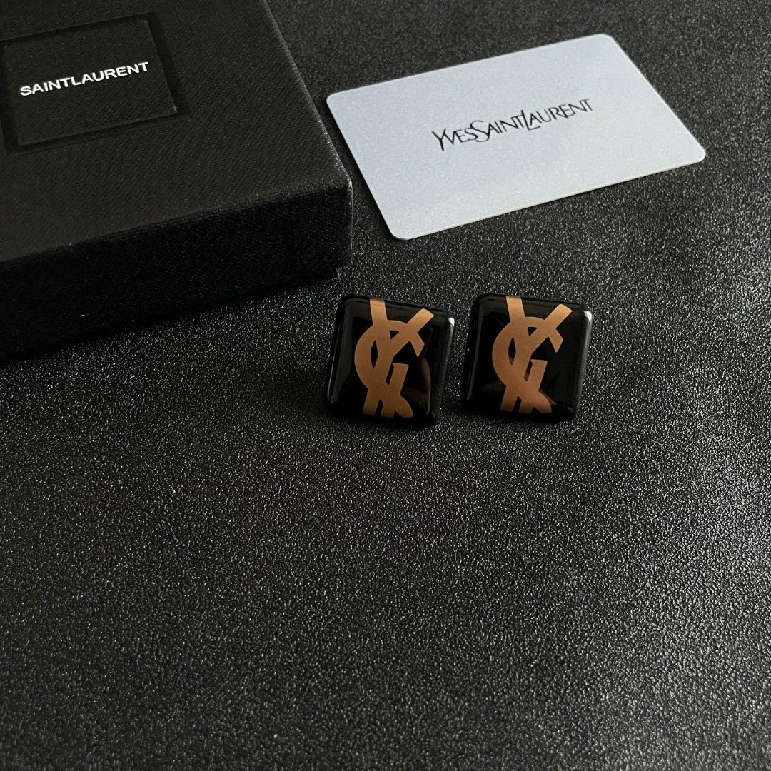 Martin Graham stud earrings in polished metal-tone – styled product view