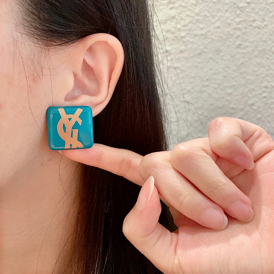 Martin Graham stud earrings in polished metal-tone – front product view