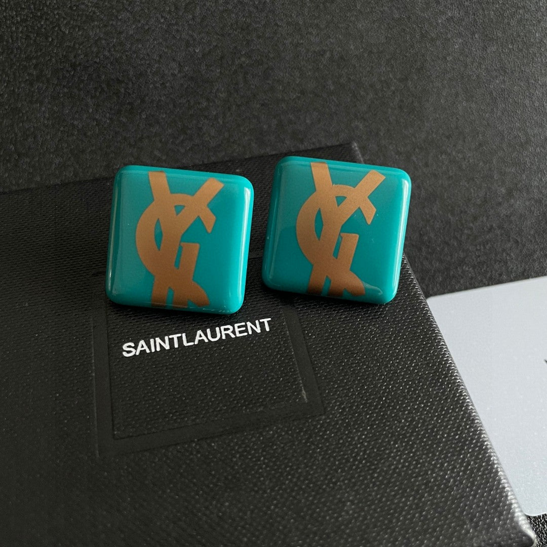 Martin Graham stud earrings in polished metal-tone – detail view