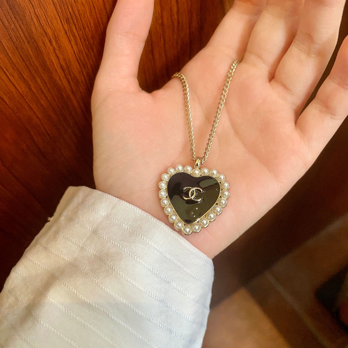 Martin Graham pendant necklace in polished metal-tone – side detail