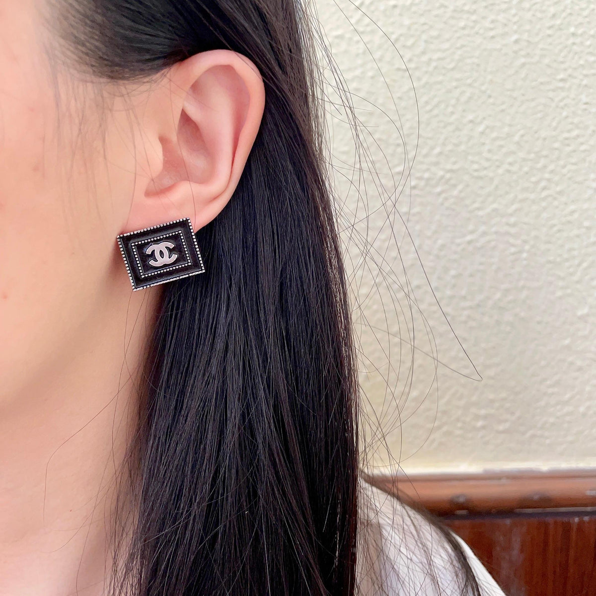 Martin Graham stud earrings in polished metal-tone – detail view