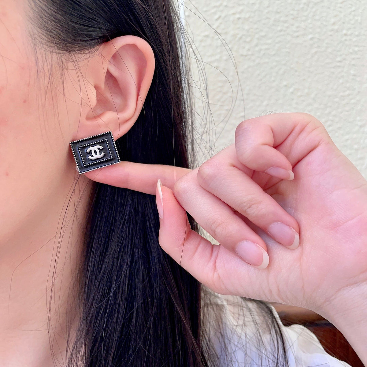 Martin Graham stud earrings in polished metal-tone – front product view