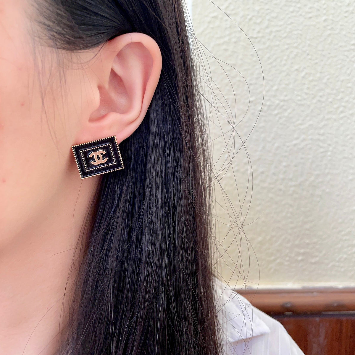 Martin Graham stud earrings in polished metal-tone – detail view