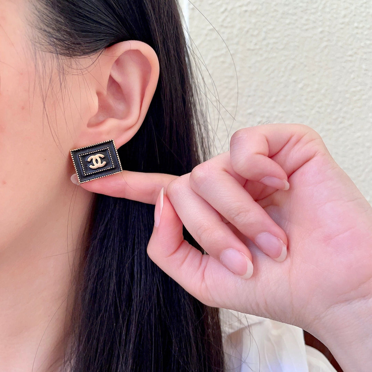 Martin Graham stud earrings in polished metal-tone – front product view