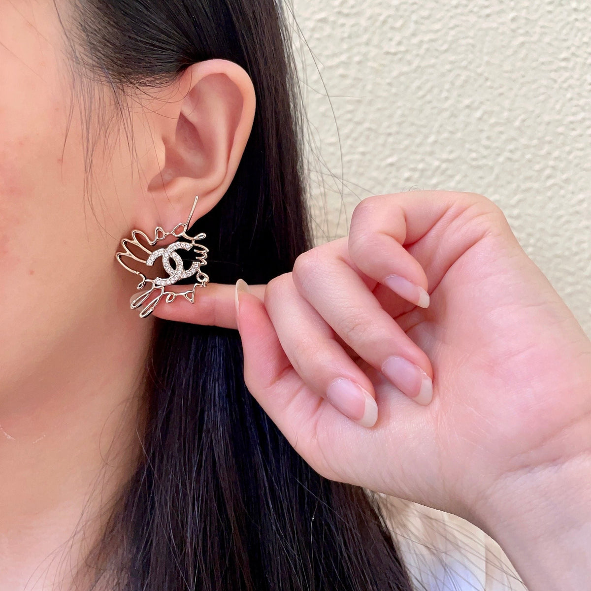 Martin Graham stud earrings in polished metal-tone – front product view