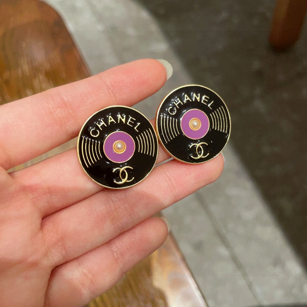 Martin Graham stud earrings in polished metal-tone – side detail