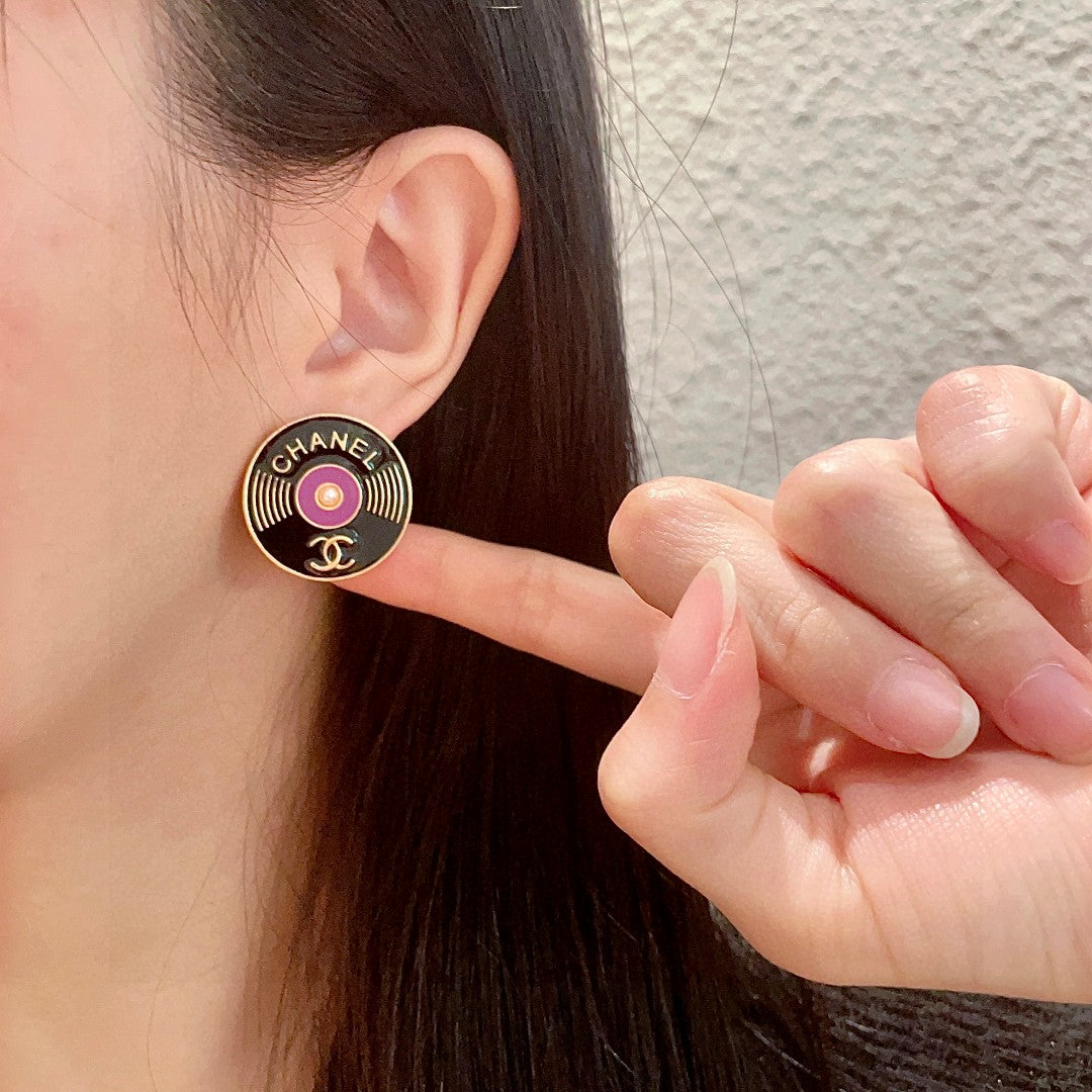 Martin Graham stud earrings in polished metal-tone – front product view