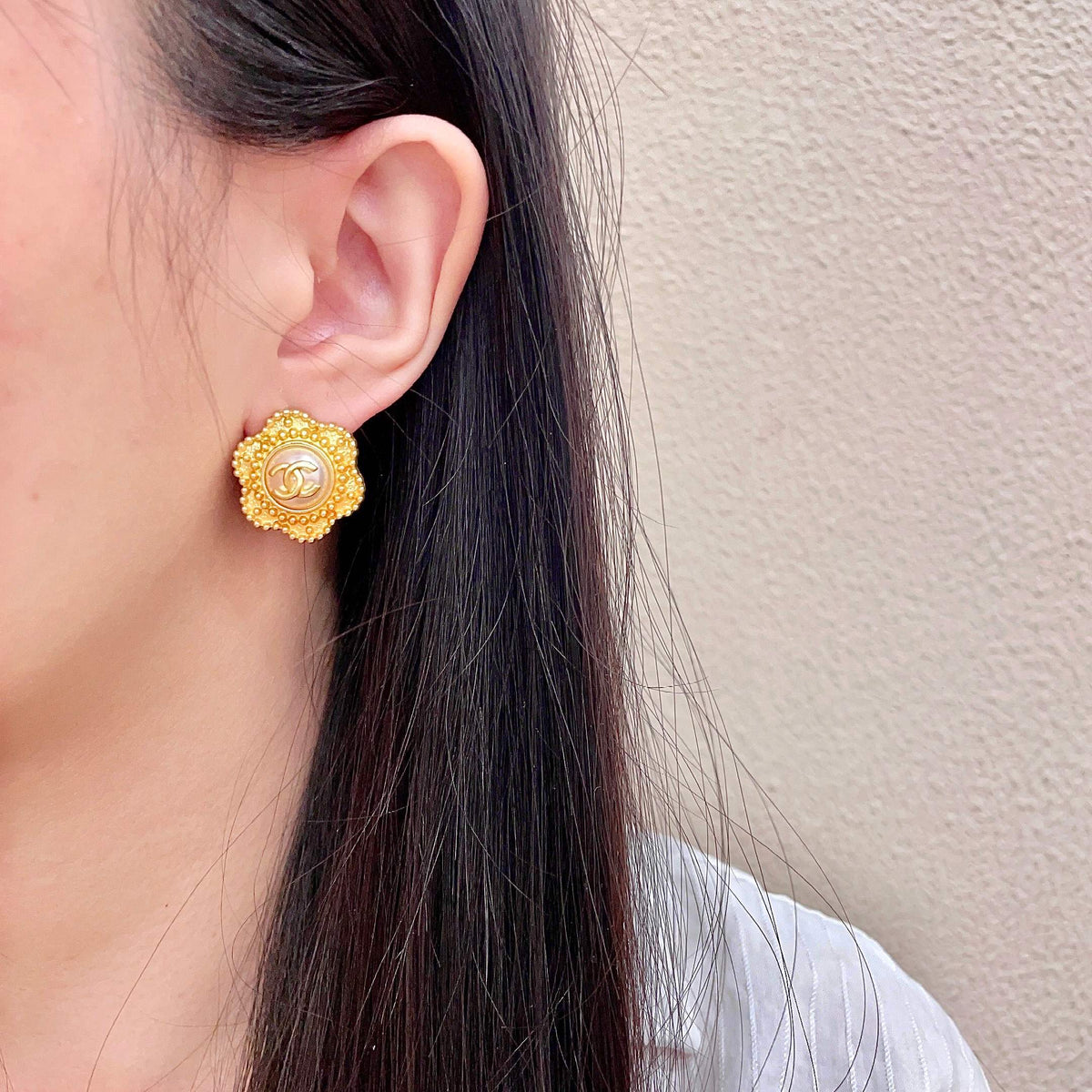 Martin Graham stud earrings in polished metal-tone – detail view