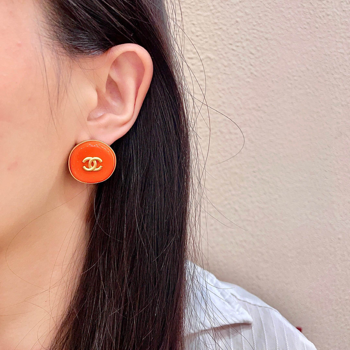 Martin Graham stud earrings in polished metal-tone – detail view