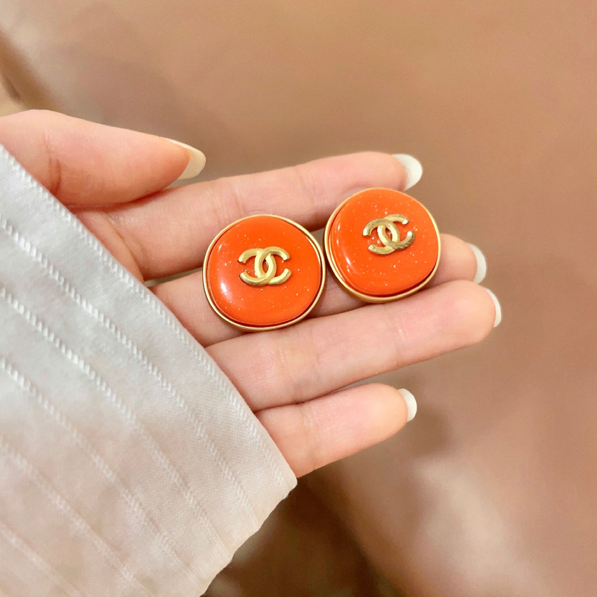 Martin Graham stud earrings in polished metal-tone – side detail