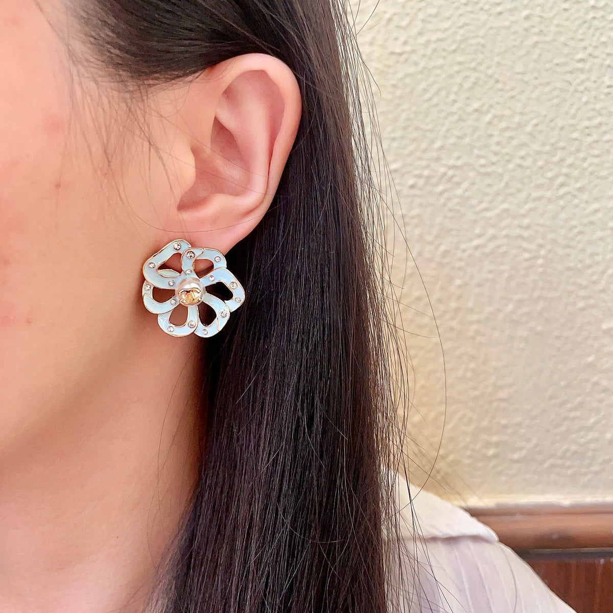Martin Graham stud earrings in polished metal-tone – detail view