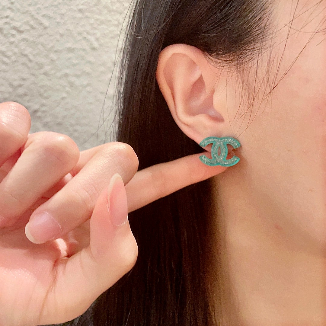 Martin Graham stud earrings in polished metal-tone – front product view