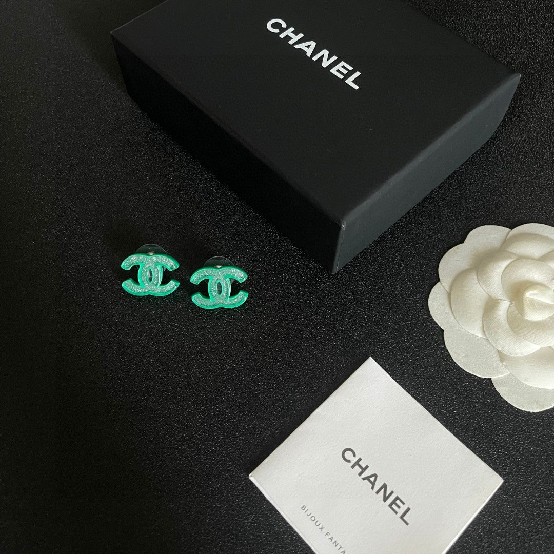 Martin Graham stud earrings in polished metal-tone – close-up detail