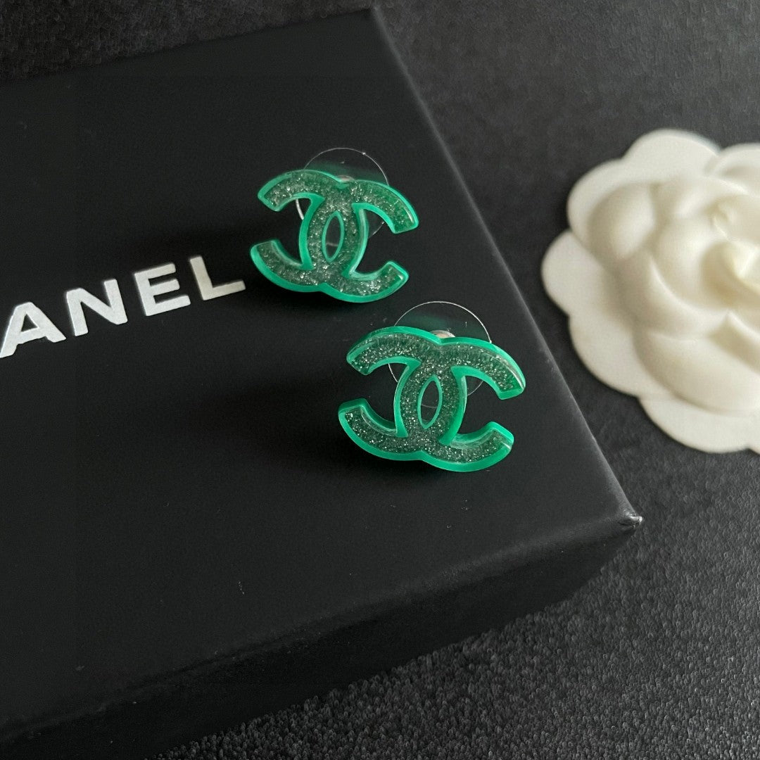 Martin Graham stud earrings in polished metal-tone – detail view