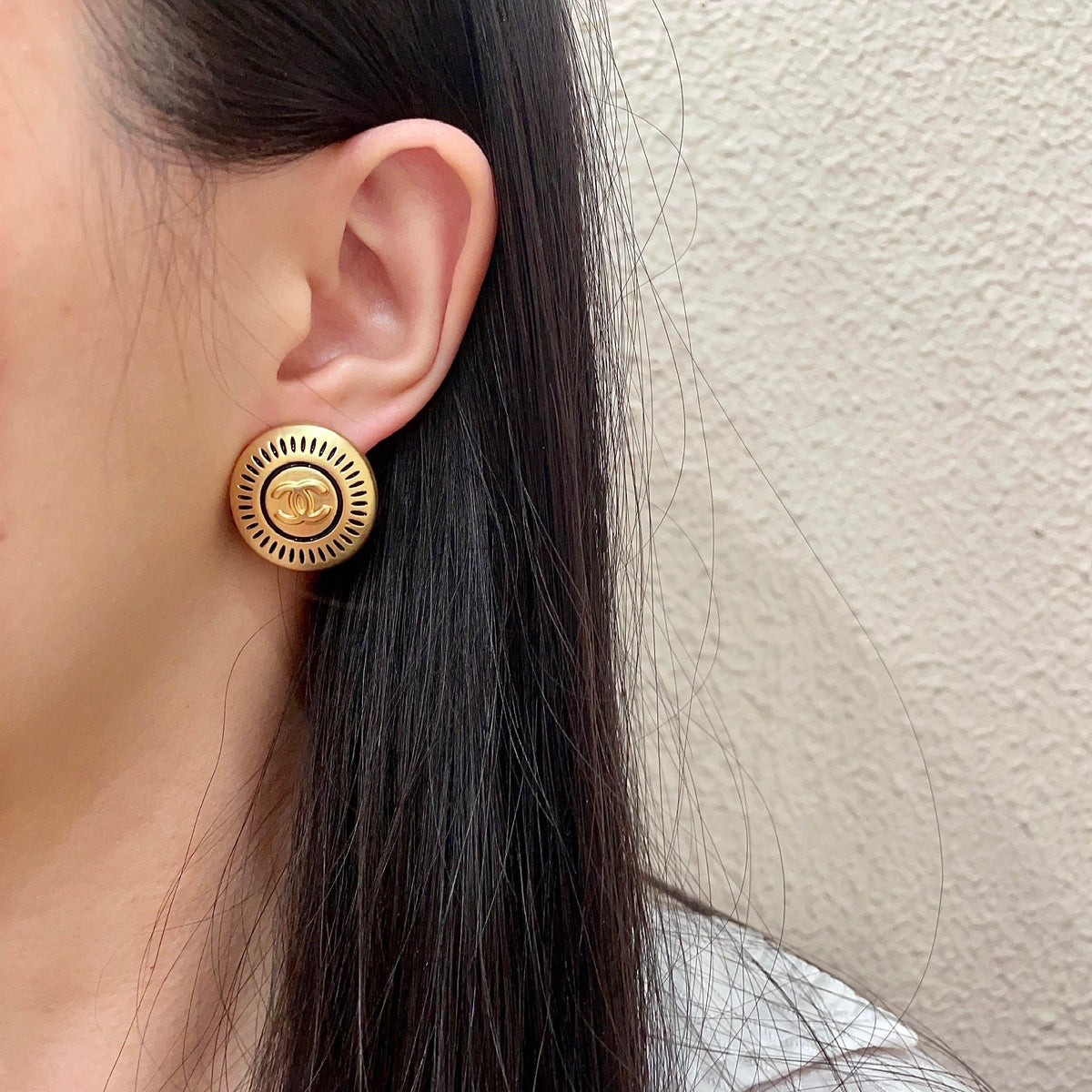 Martin Graham stud earrings in polished metal-tone – detail view