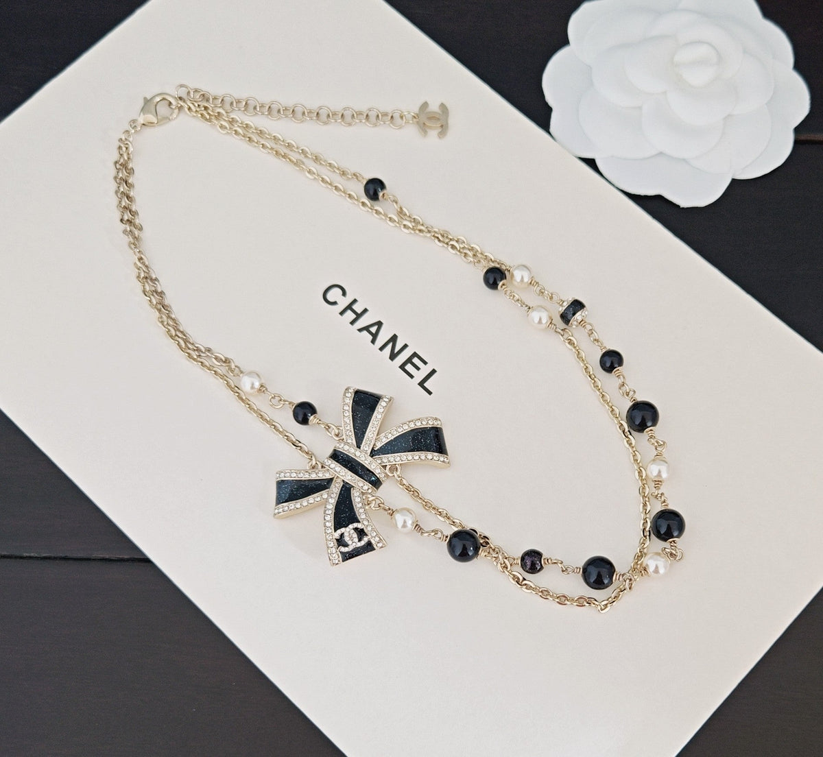 Martin Graham pendant necklace in polished metal-tone – close-up detail