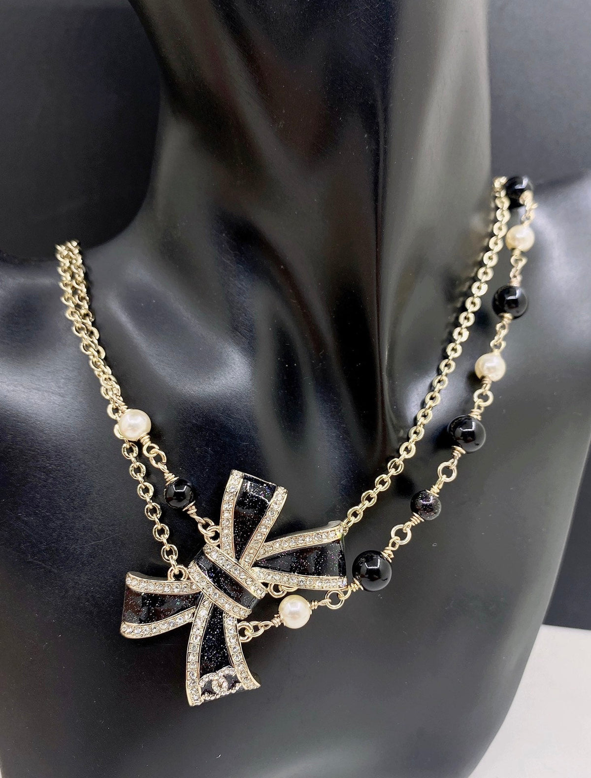 Martin Graham pendant necklace in polished metal-tone – front product view