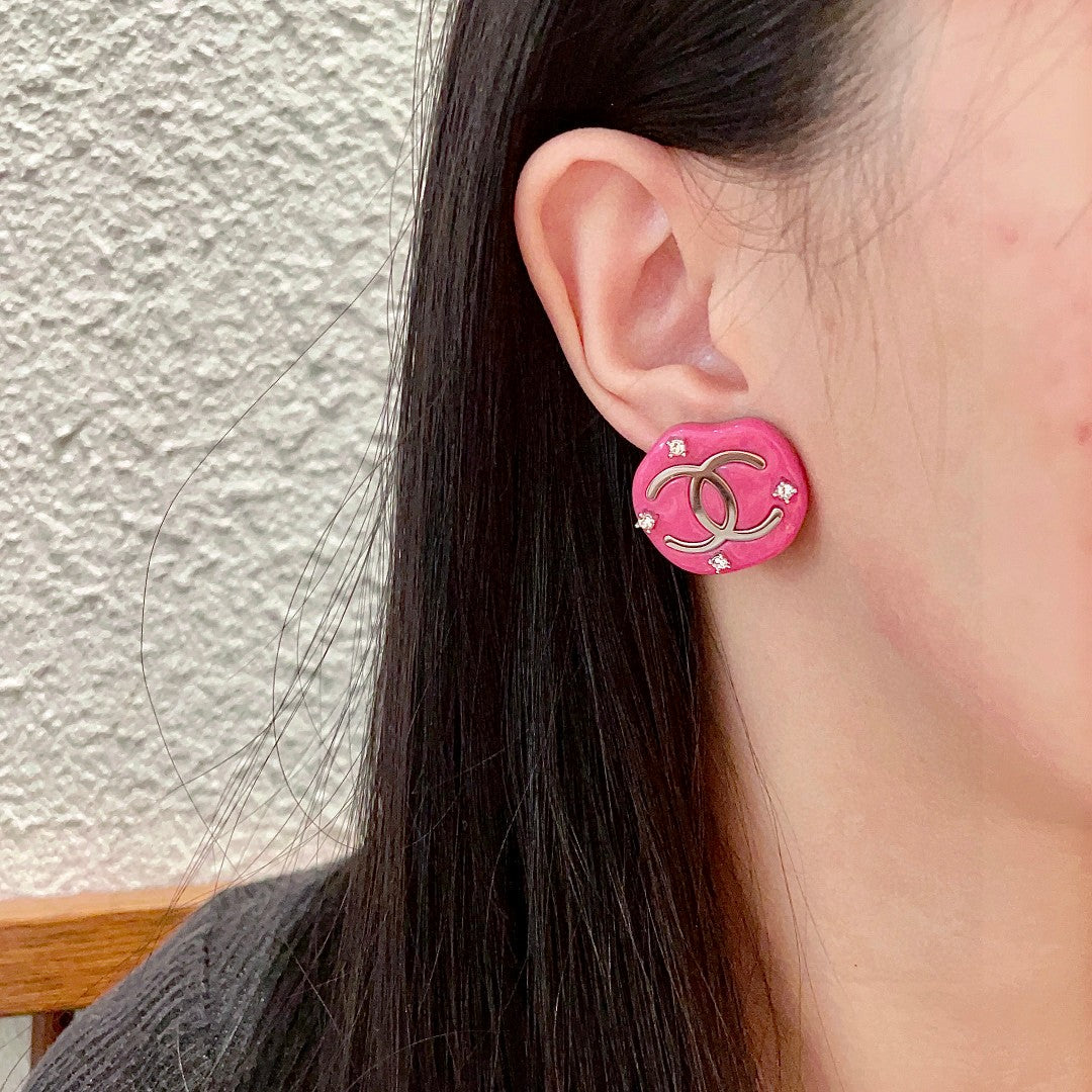 Martin Graham stud earrings in polished metal-tone – front product view