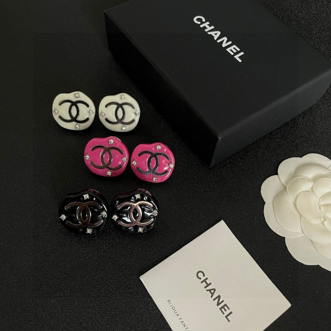 Martin Graham stud earrings in polished metal-tone – close-up detail