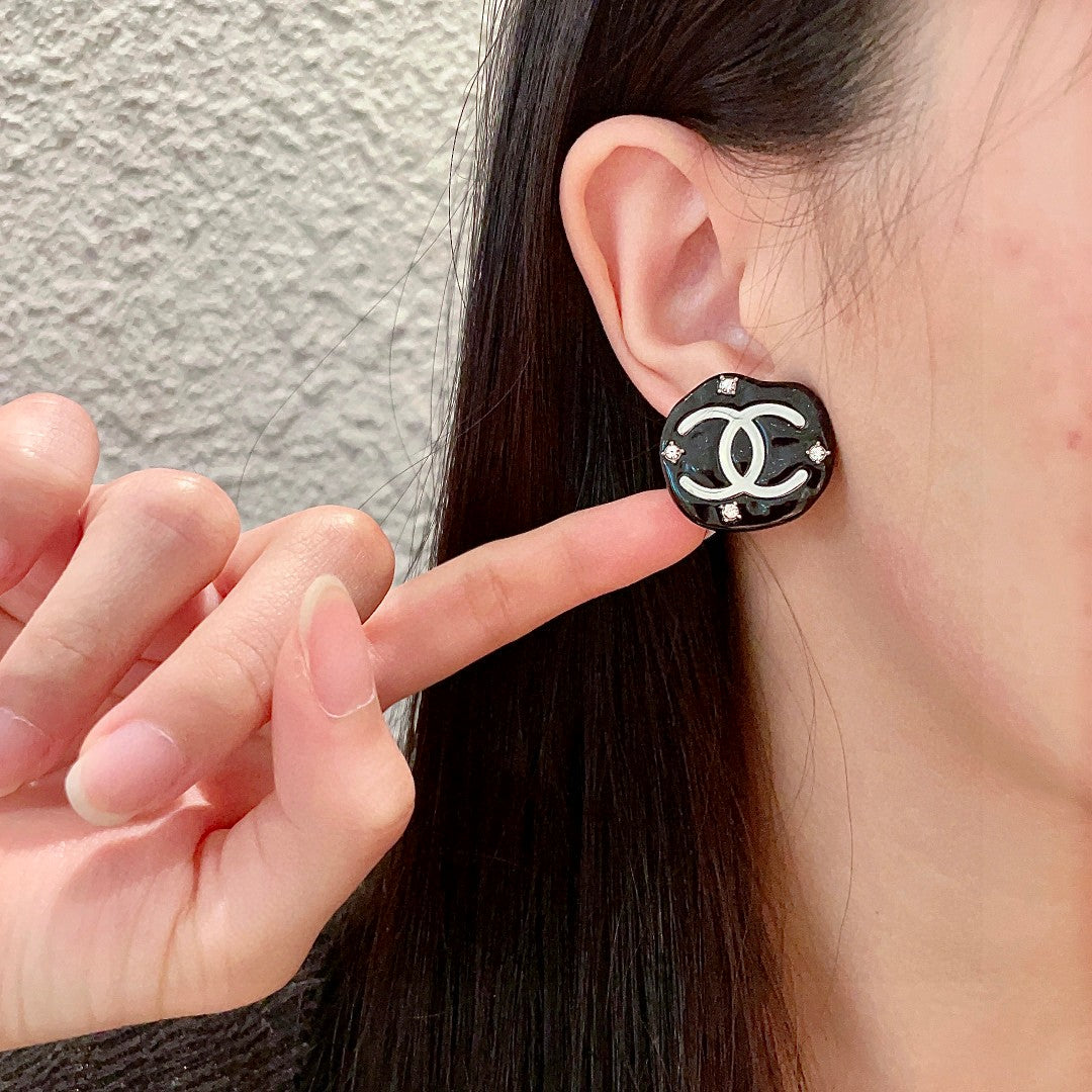 Martin Graham stud earrings in polished metal-tone – front product view