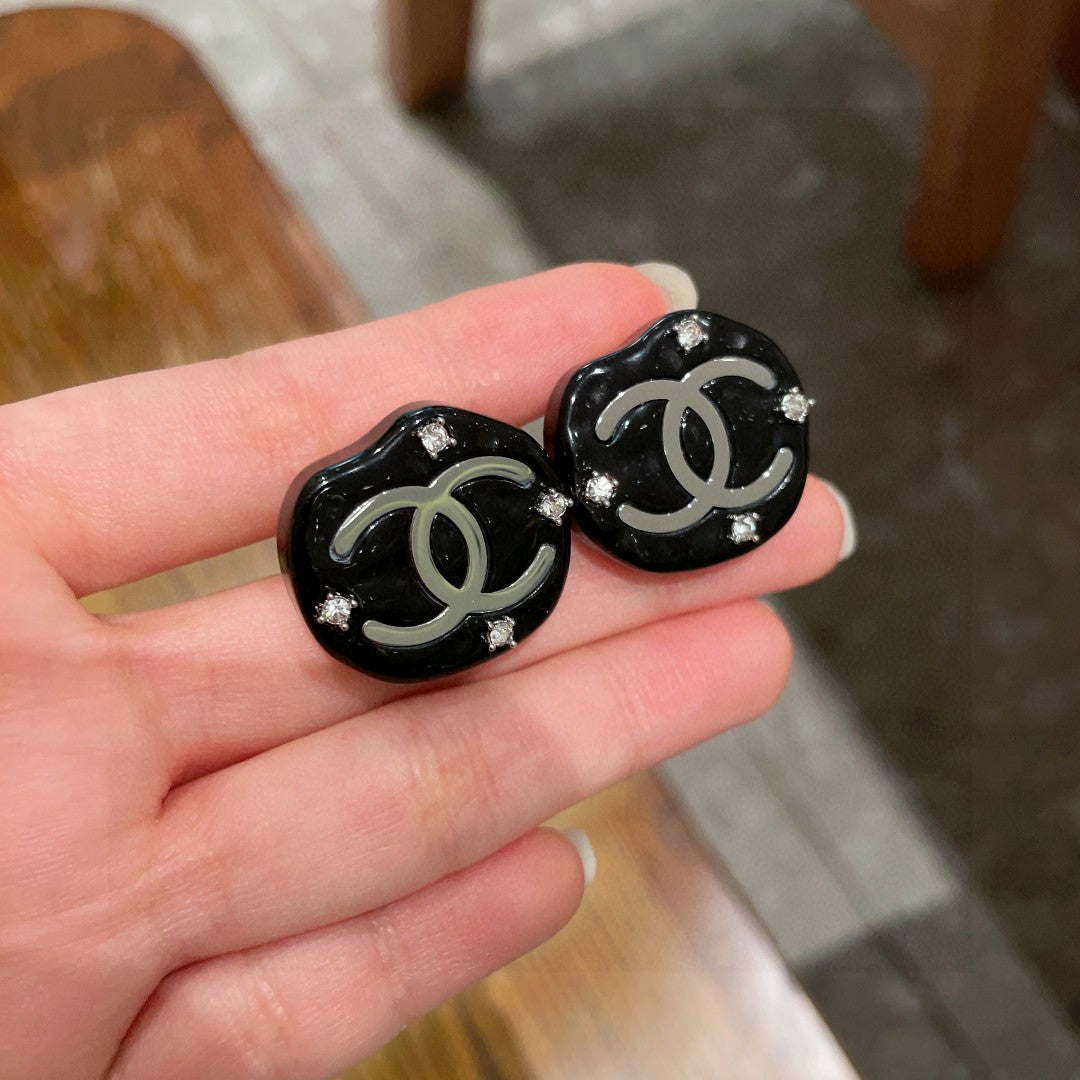 Martin Graham stud earrings in polished metal-tone – side detail