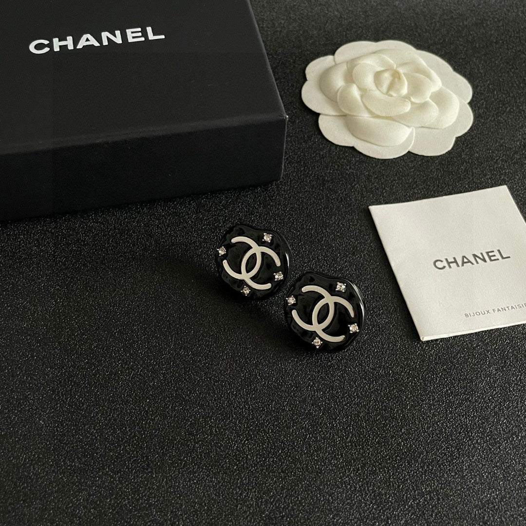 Martin Graham stud earrings in polished metal-tone – styled product view