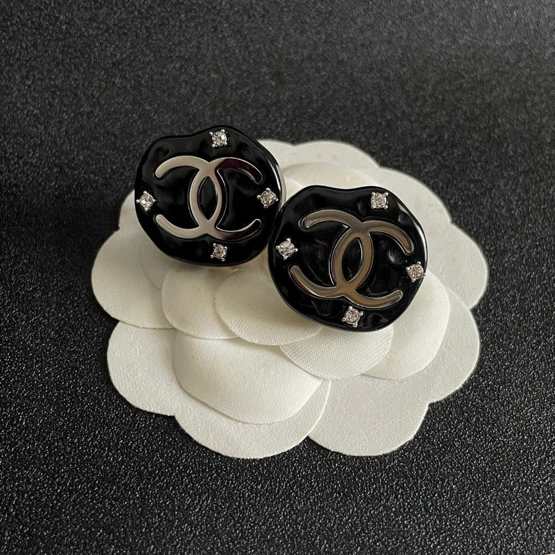 Martin Graham stud earrings in polished metal-tone – front product view