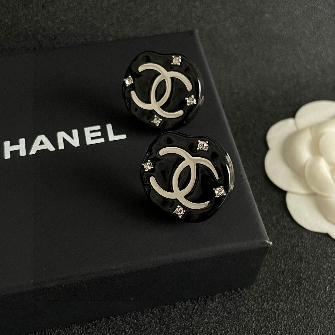 Martin Graham stud earrings in polished metal-tone – detail view