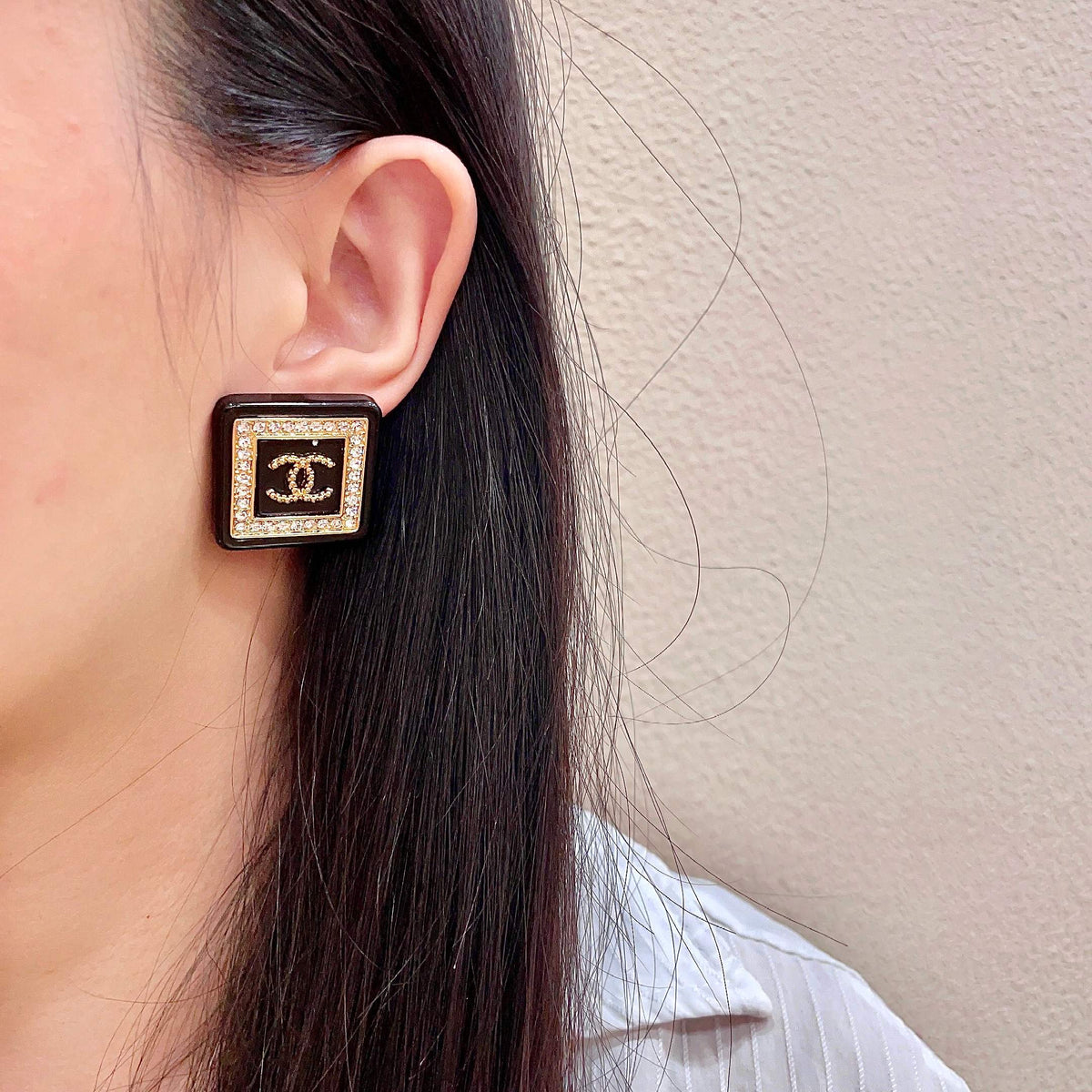 Martin Graham stud earrings in polished metal-tone – detail view