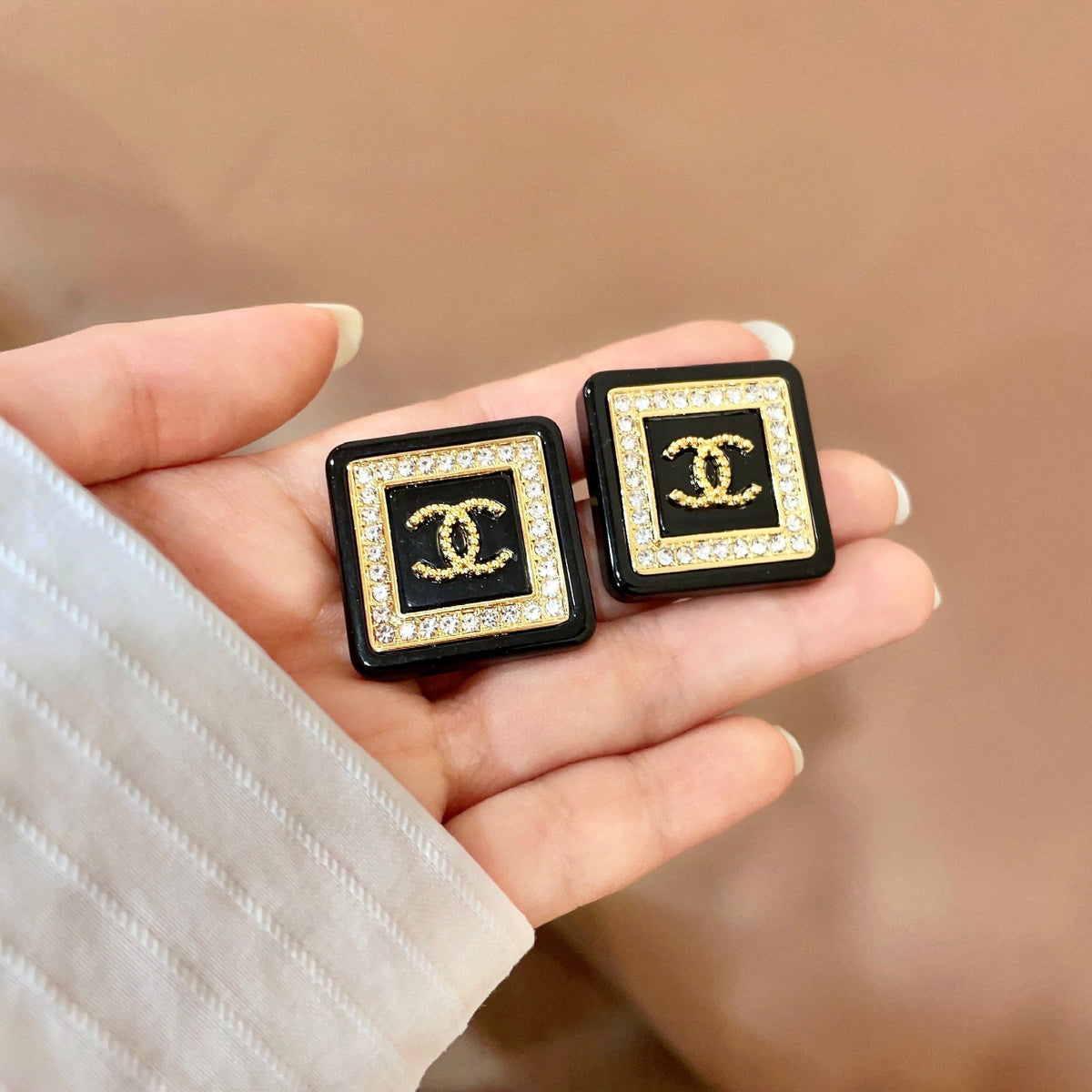 Martin Graham stud earrings in polished metal-tone – side detail